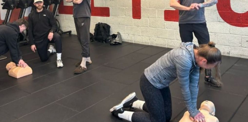 trainer teaching in onsite first aid training venue
