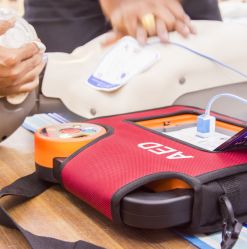 aed and manikin on table